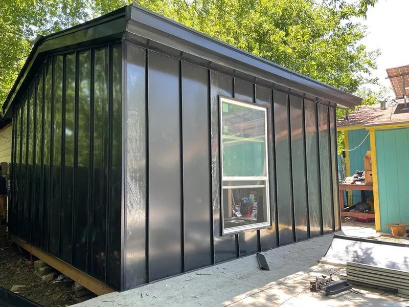 Black standing seam metal wall panels for Roof Inspection in St. George